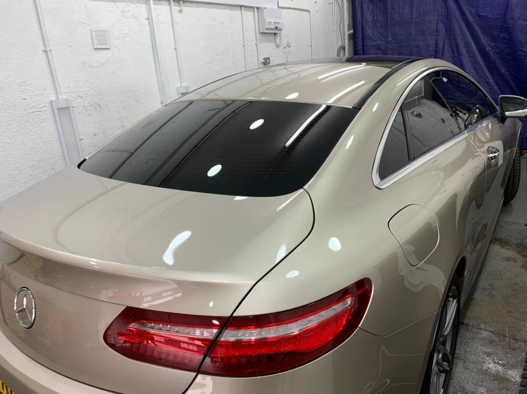 Silver Mercedes coupe with dark tinted rear screen