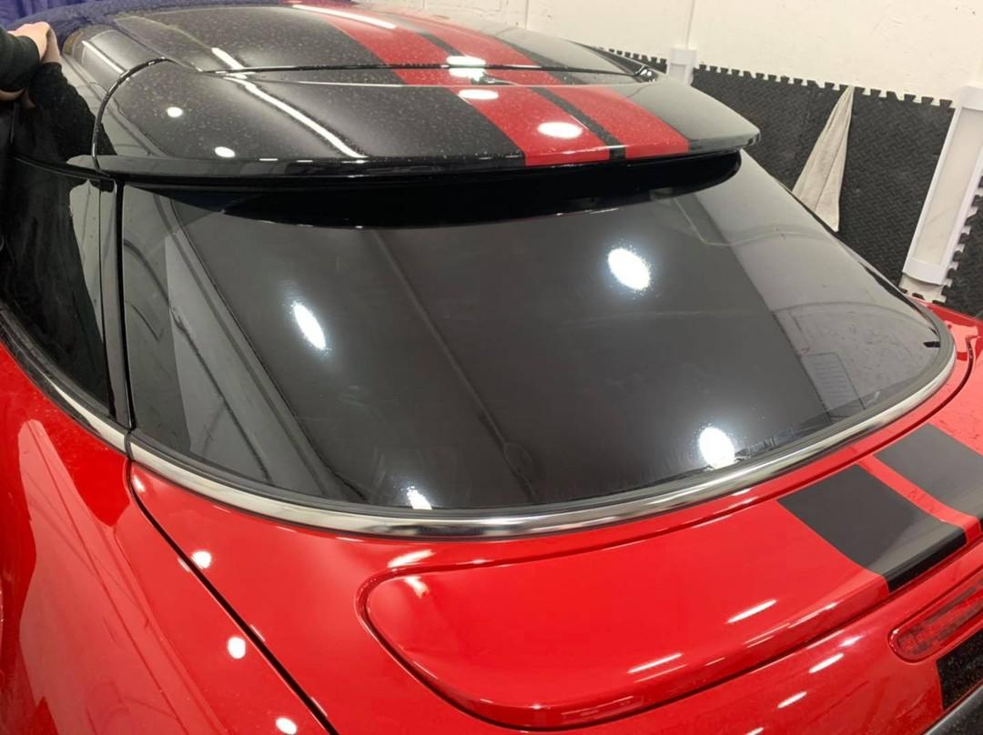 Red Mini with dark tinted rear screen and rear side windows